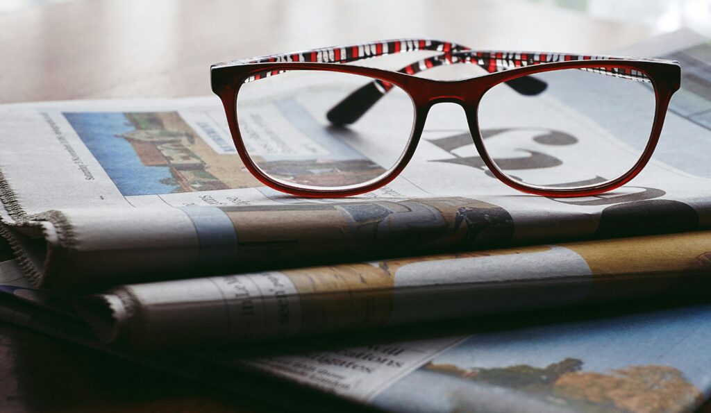 glasses on newspaper