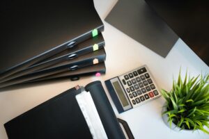 Essential estate planning UK comprehensive documents including Wills, LPAs, and trust folders with calculator