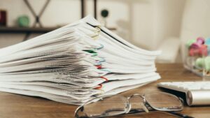Essential estate planning documents UK every plan needs showing organised stacks of important legal papers and documentation for comprehensive estate planning