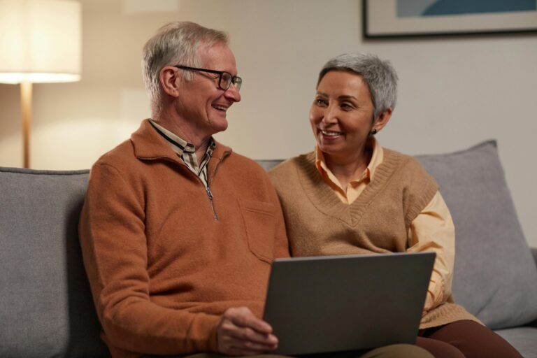 Free Wills Month UK elderly couple reviewing estate planning options together on laptop