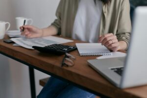 What happens if there is no will UK showing person calculating estate planning documents and inheritance planning to avoid intestacy consequences