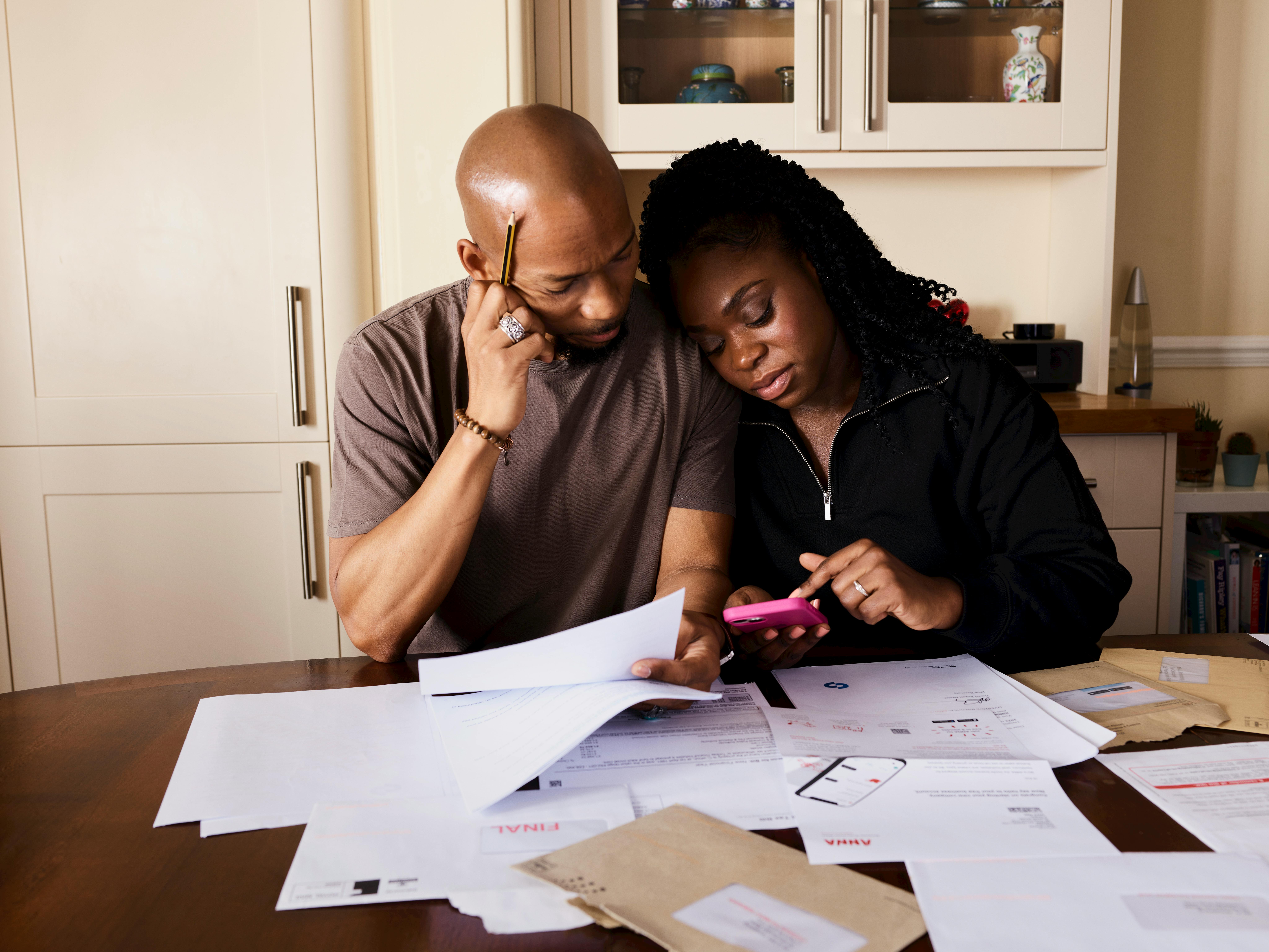 Mirror wills UK benefits showing married couple planning estate documents together for comprehensive family protection and inheritance planning