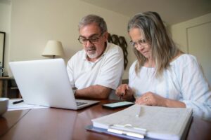 lasting power of attorney guide couple reviewing legal documents at home